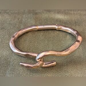 Silver metal plated “Hooked on a Feeling” bracelet with spring hinge.
